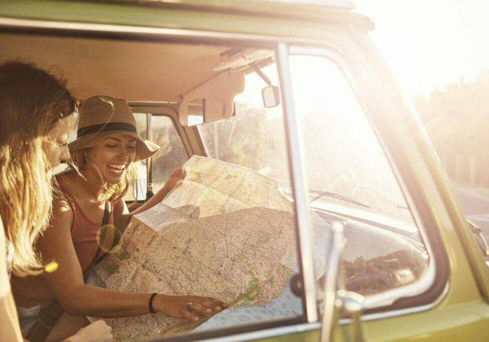 Shot of two friends looking at a map while out on a roadtriphttp://195.154.178.81/DATA/i_collage/pu/shoots/806323.jpg